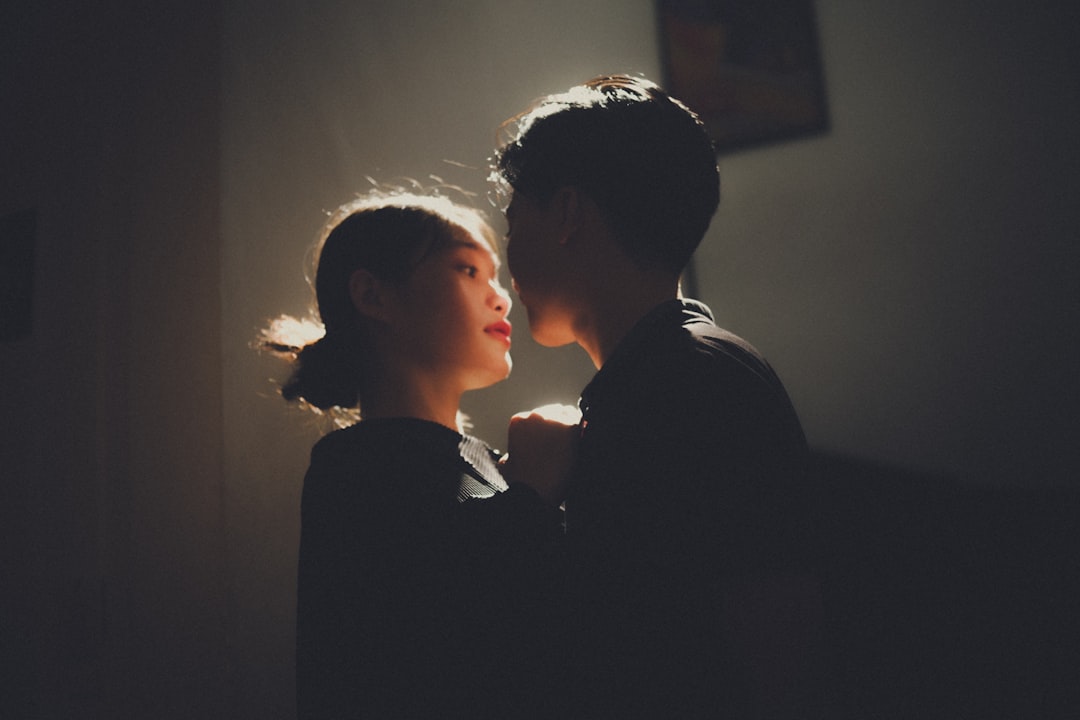 a couple of people standing next to each other