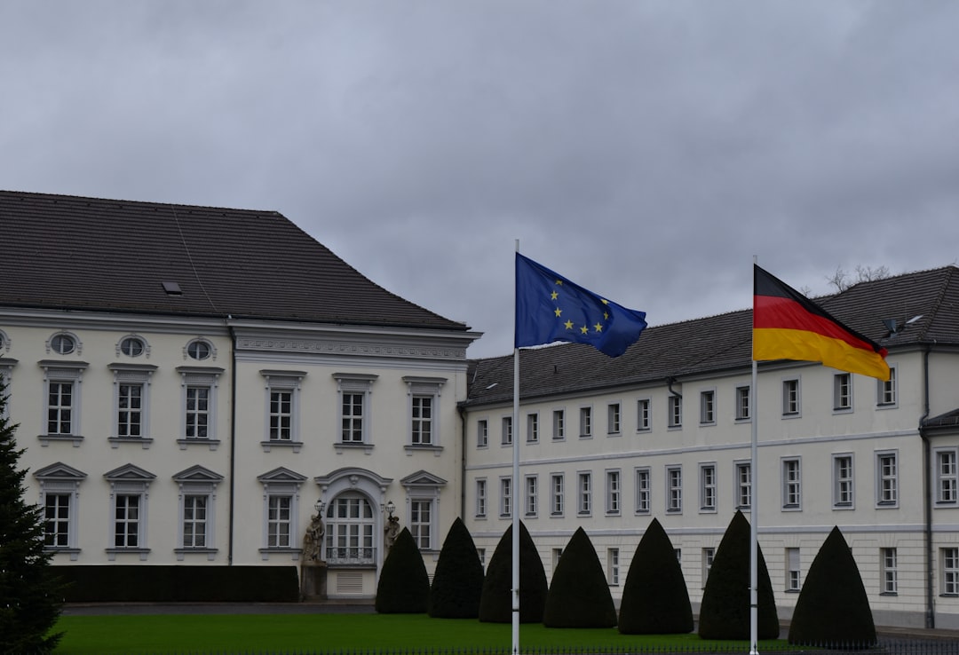 A large white building with a flag on top of it